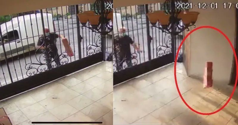 Evidencian a repartidor que aventó paquete a una casa: era una laptop